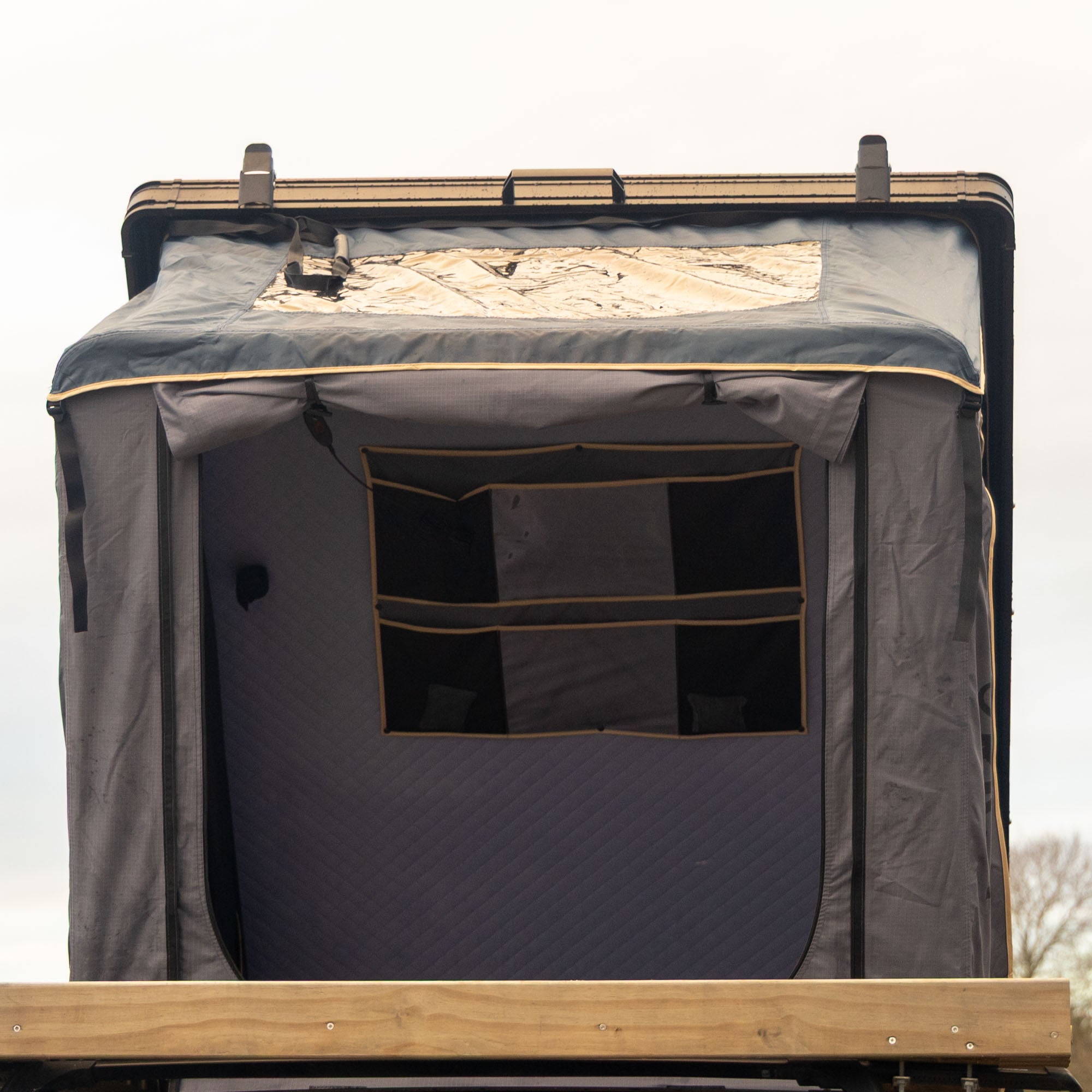 Hardshell tent on SUV ready for adventure near Rotorua hot springs. 